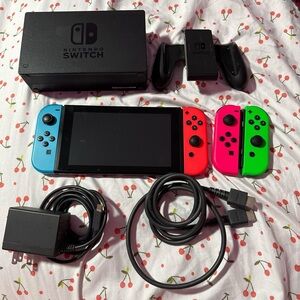 Nintendo Switch Console with Neon Blue, Red, and Green Joy-Con